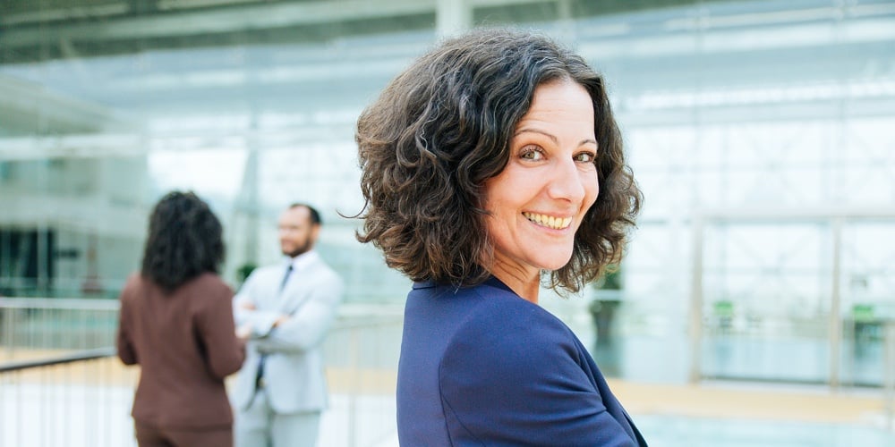 Happy Successful Business Woman Posing With Arms Folded