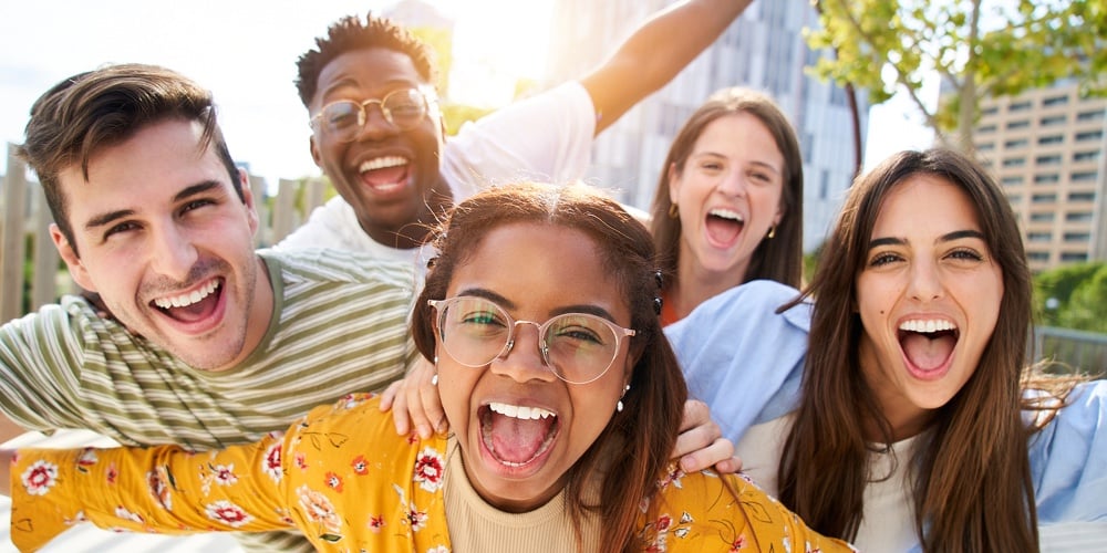 Happy Young Friends Looking Camera And Laughing Smiling Group Of People Having Fun Together Outdoors