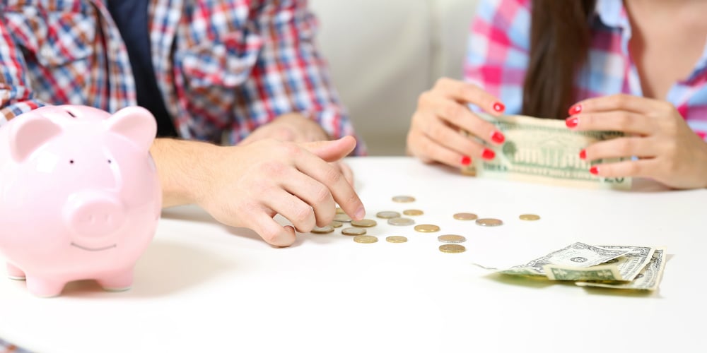 bigstock-Happy-couple-counting-money-fr-113960144