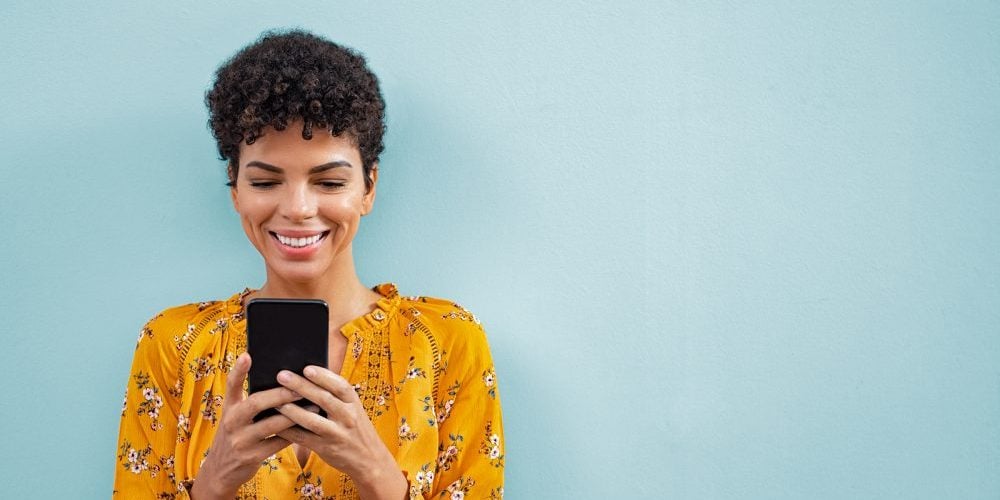 1-LogixRewards|2-What’s Logix Doing|3-NeilPatel-Covid|4-HereToHelp above Banking Center|5-Above Mobile Banking app|Happy smiling black woman using smart phone. Young brazilian wom