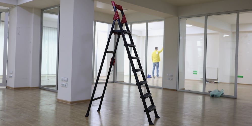 High Ladder Standing In Center Of Empty Office. Rent New Commercial Real Estate