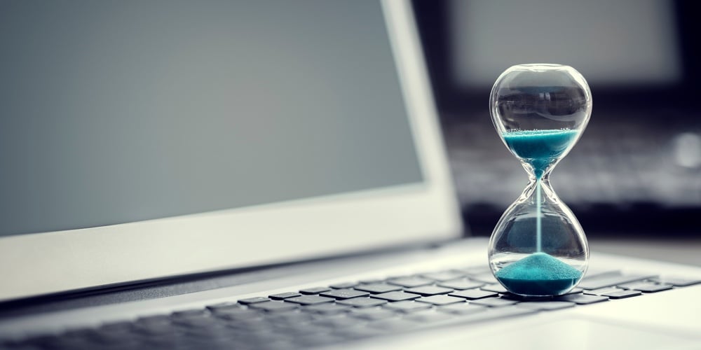 bigstock-Tired-bored-young-businessman–90602234|Hourglass on laptop computer concept for time management and countdown to deadline