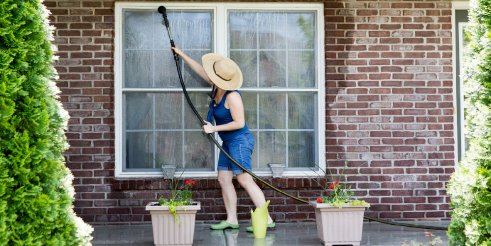bigstock-Housewife-Washing-The-Windows–90077612