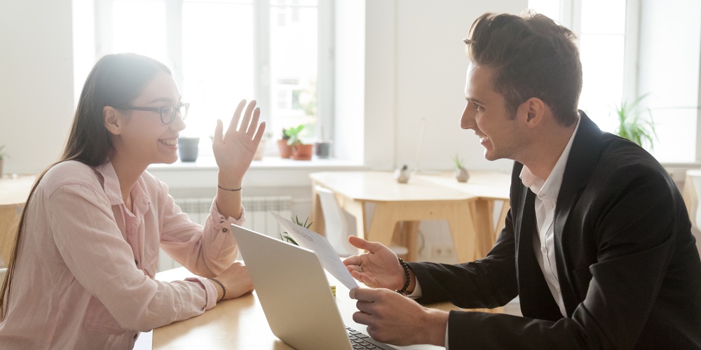 Hr And Applicant Laughing During Successful Job Interview