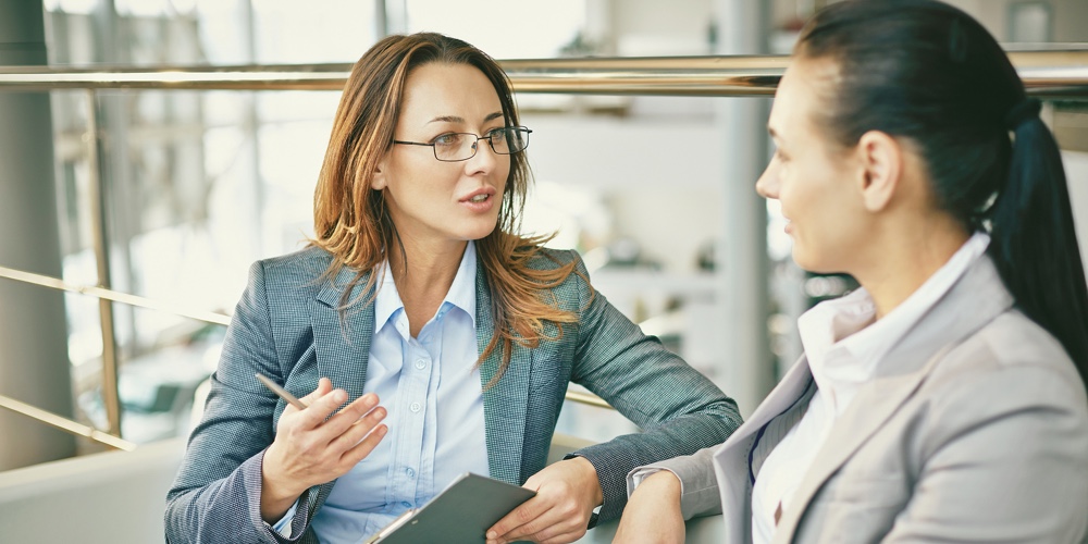 Hr manager asking questions to female candidate