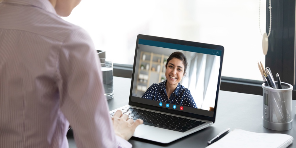 Indian Girl Communicates With Friend On-line By Video Call