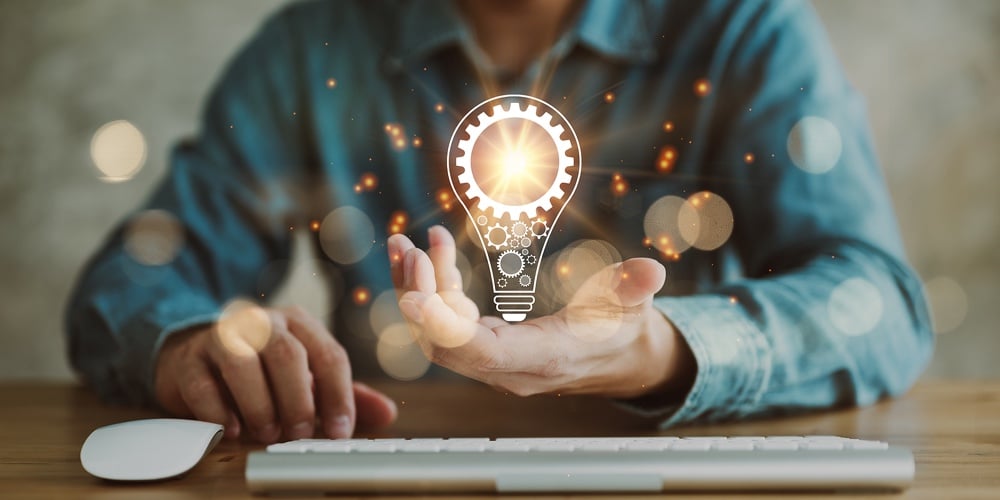 bigstock-Innovation-Hands-Holding-Ligh-431804870