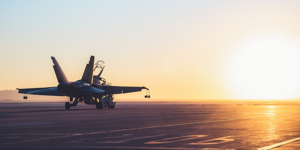 Jet Fighter On An Aircraft Carrier Deck Against Beautiful Sunset Sky . Elements Of This Image Furnis