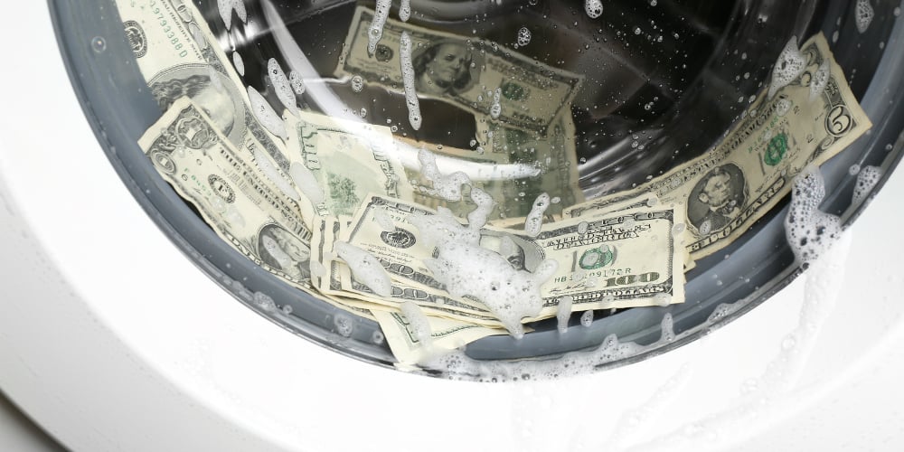 bigstock-laundering-of-dirty-money-in-w-106958255