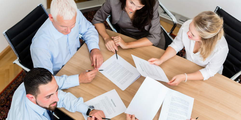 bigstock-Lawyers-having-team-meeting-in-116461250