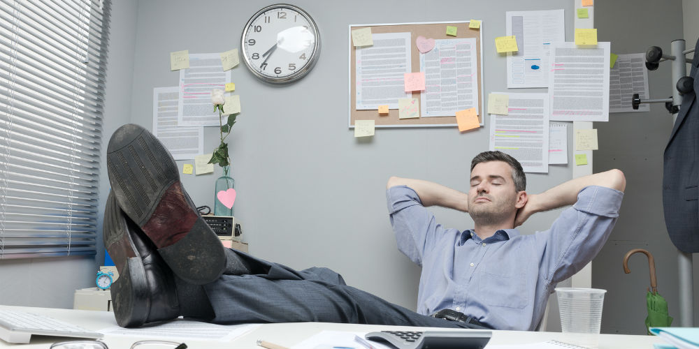 bigstock-Lazy-Office-Worker-Feet-Up-75401689