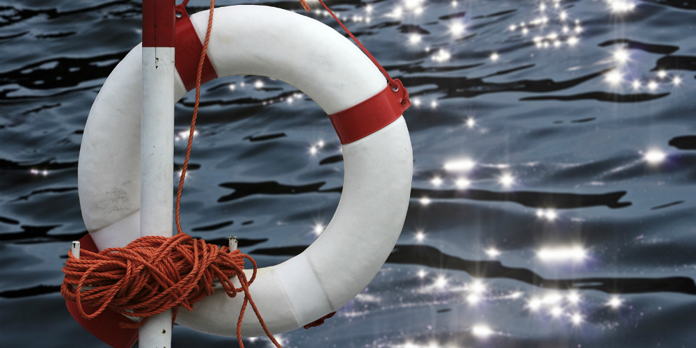 bigstock-life-buoy-in-front-of-glitteri-5146619