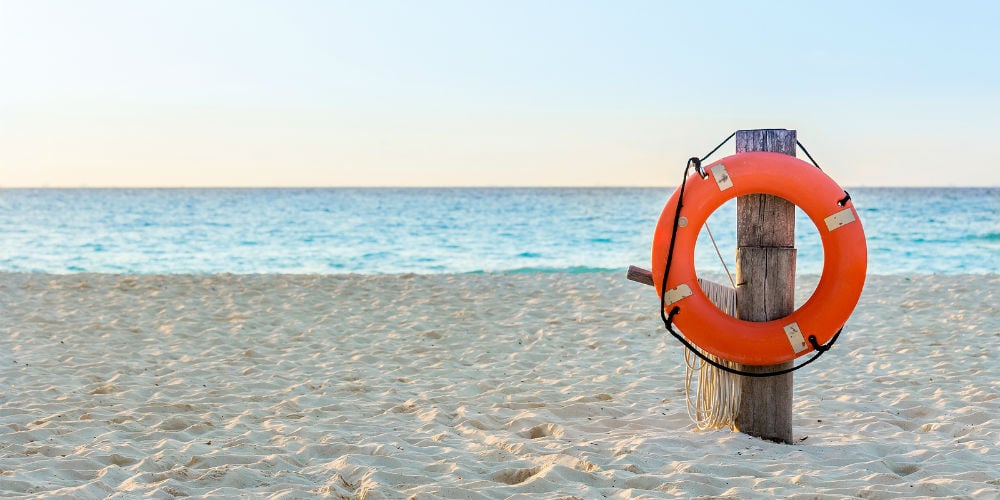 bigstock-Life-Preserver-On-Sandy-Beach-89648471