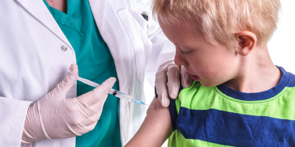 bigstock-Little-Boy-Is-Given-An-Injecti-89975927