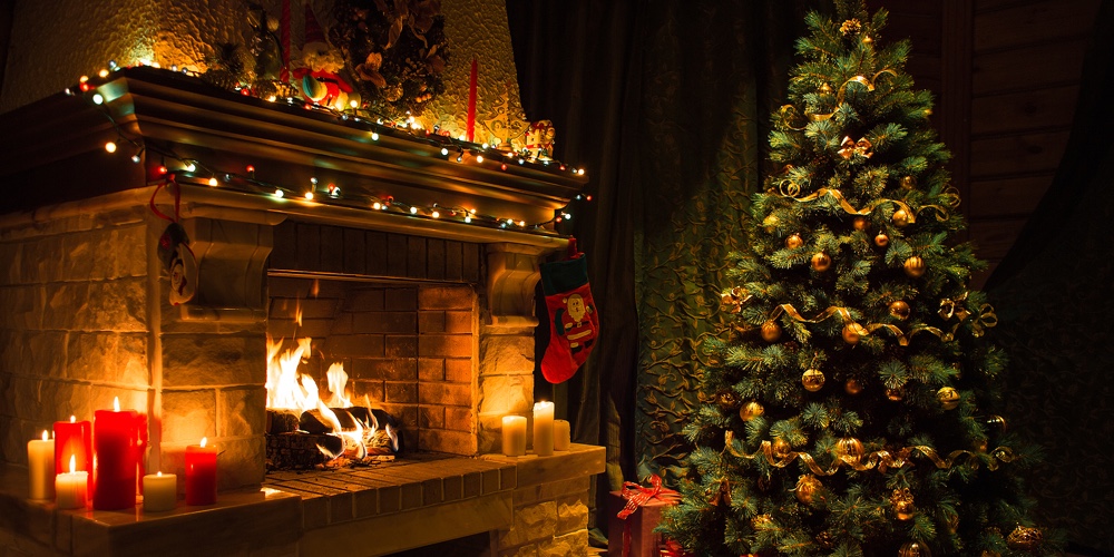 Living room home interior with decorated fireplace and christmas tree
