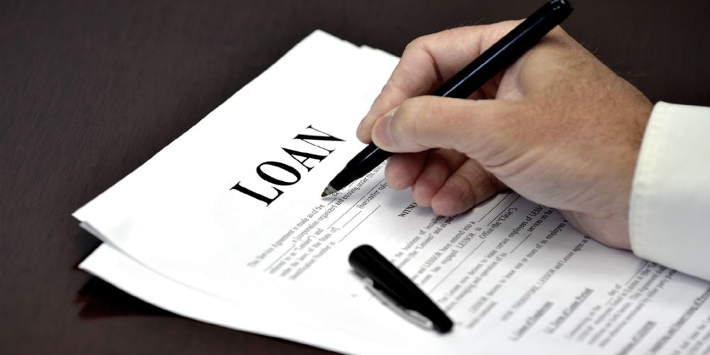 bigstock-Loan-document-and-agreement-wi-80708969