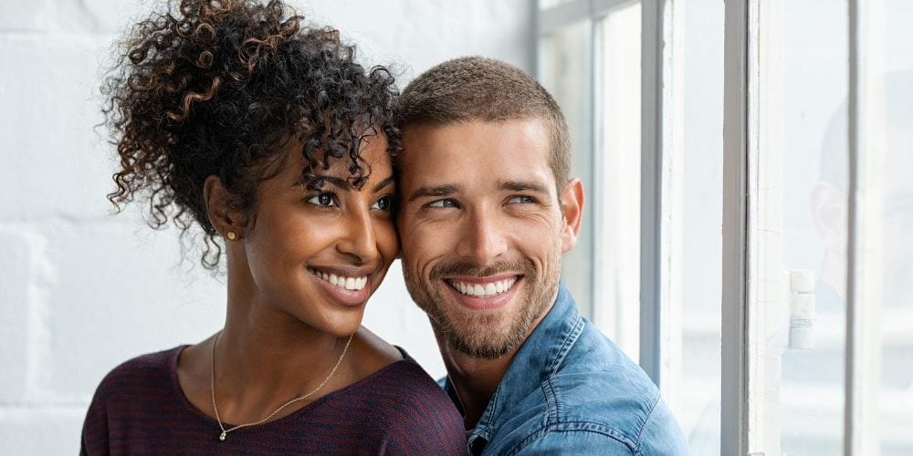 bigstock-Loving-multiethnic-couple-embr-309165430-e1593466275375