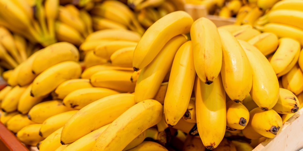 Reading glasses or spectacles on banana. Banana is a brain food concept.|Macro Photo Food Tropical Fruit Bananas. Texture Background Yellow Bananas In The Peel. Product Imag
