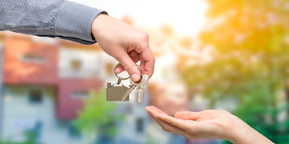 bigstock-Man-Is-Handing-A-House-Key-To-120550964