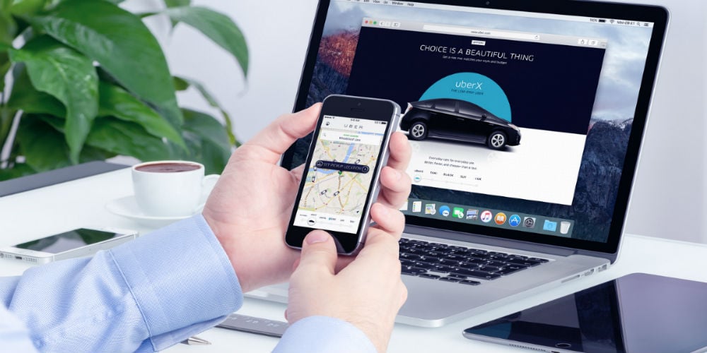 bigstock-Man-Orders-Uber-X-Through-His-97285145