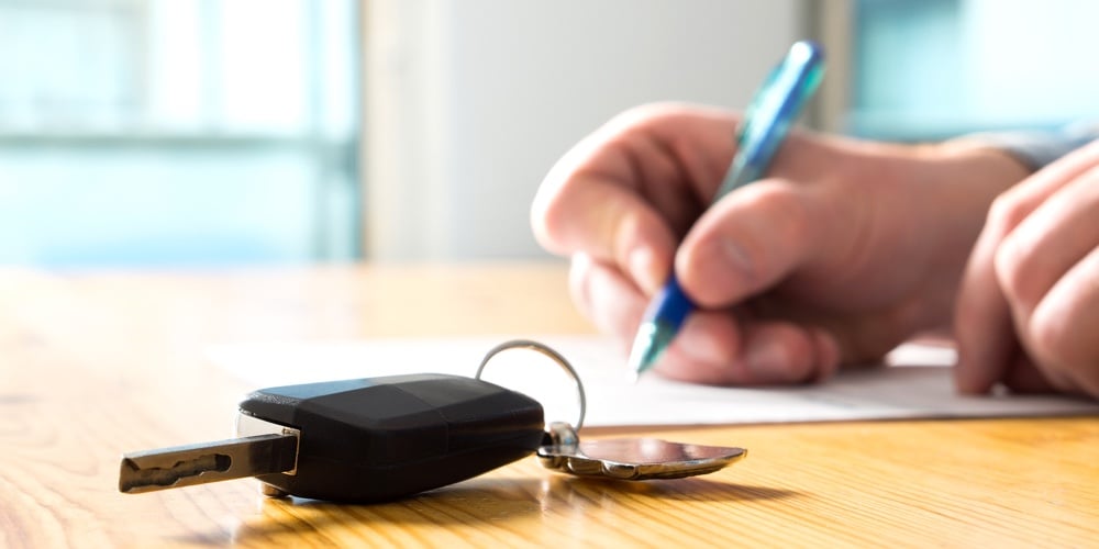 Man Signing Car Insurance Document Or Lease Paper. Writing Signature On Contract Or Agreement. Buyin