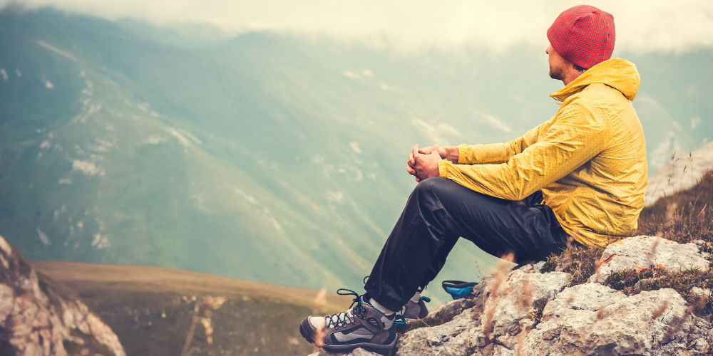 bigstock-Man-Traveler-relaxing-alone-in-84557870