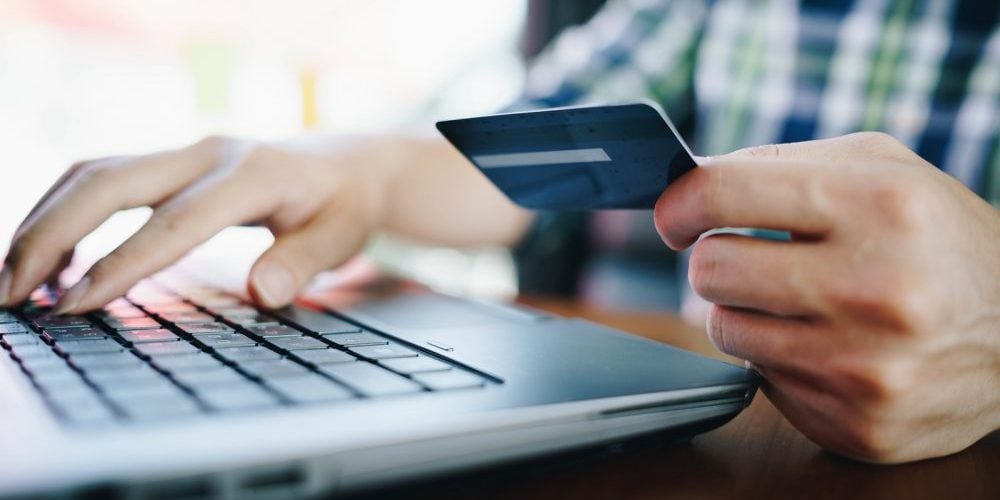 bigstock-Man-With-Laptop-And-Credit-Car-263658760-e1582823288740