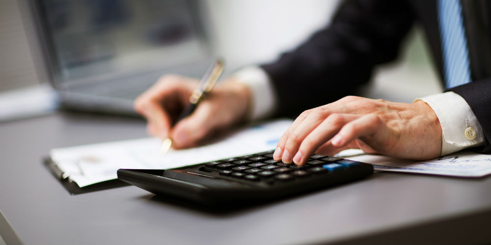 bigstock-Man-doing-his-accounting-finan-82252211