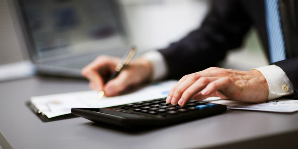 bigstock-Man-doing-his-accounting-finan-822522111