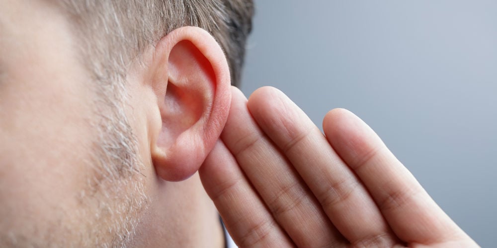 bigstock-Man-with-hand-on-ear-listening-114610118
