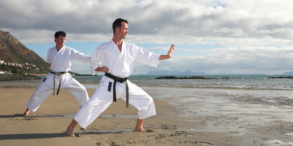 bigstock-Men-Practicing-Karate-On-The-B-1843161