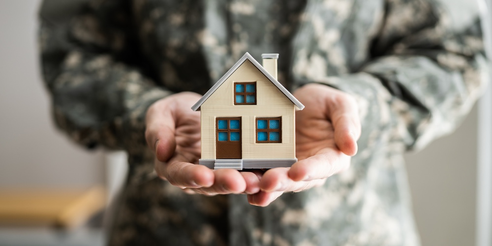 Military Army Man In Uniform Holding New House