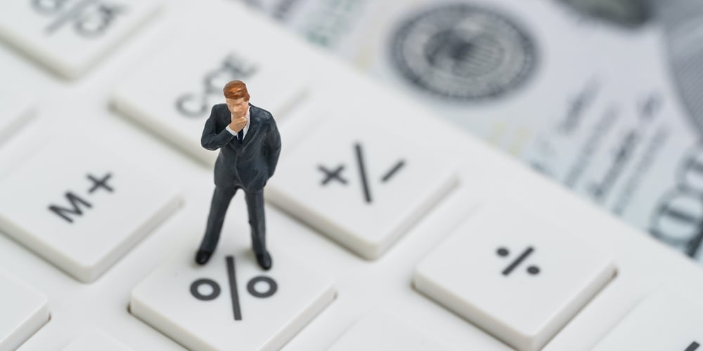 Miniature People Business Man Standing And Thinking On Calculator Percentage Button Using As Fed Con