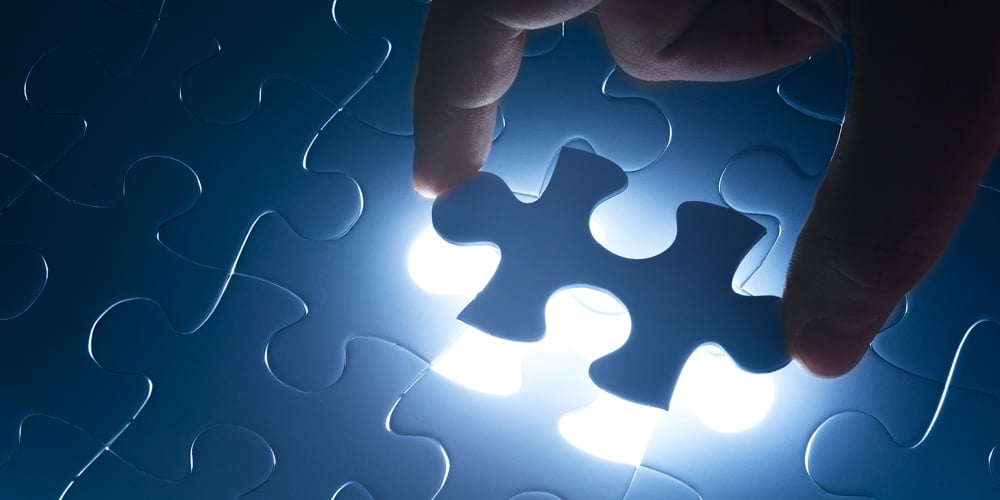 Missing jigsaw puzzle piece with light glow