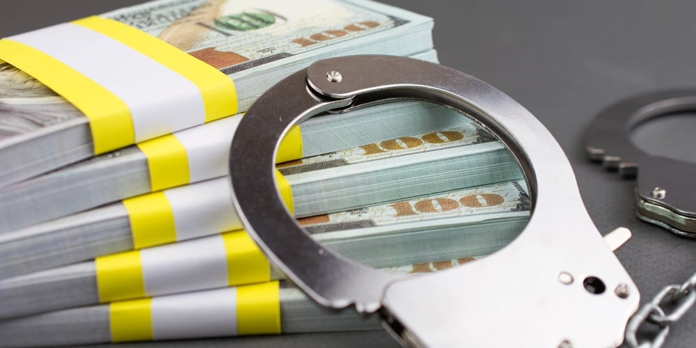 bigstock-Money-And-Handcuffs-Financial-302987938