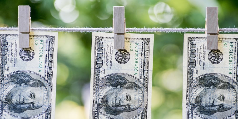 Money Laundering. Money Laundering Us Dollars Hung Out To Dry. 100 Dollar Bills Hanging On Clothesli