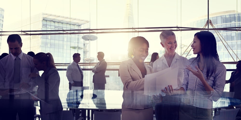 Multi-Ethnic Group Of Business People Working In A Board Room