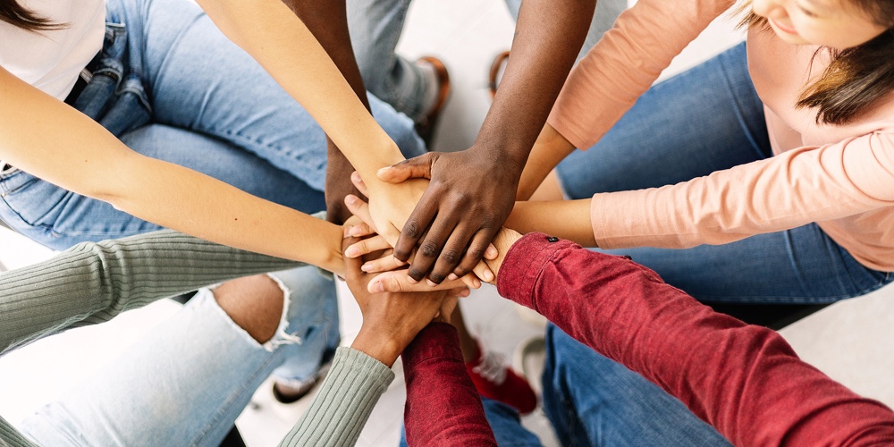 Multiethnic Young Friends People Putting Their Hands Together Showing Community