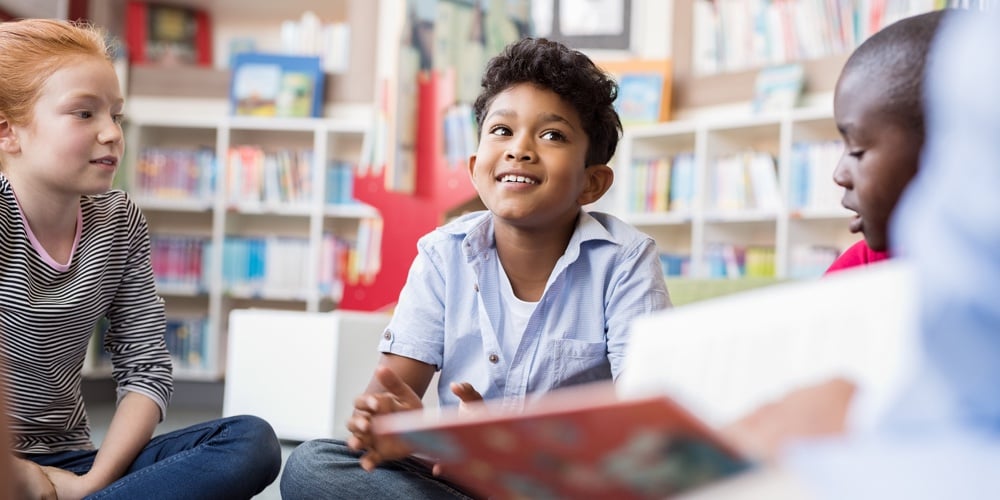 bigstock-Multiethnic-group-of-kids-sitt-239909776