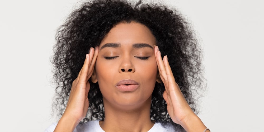 bigstock-Nervous-African-Woman-Breathin-282184345