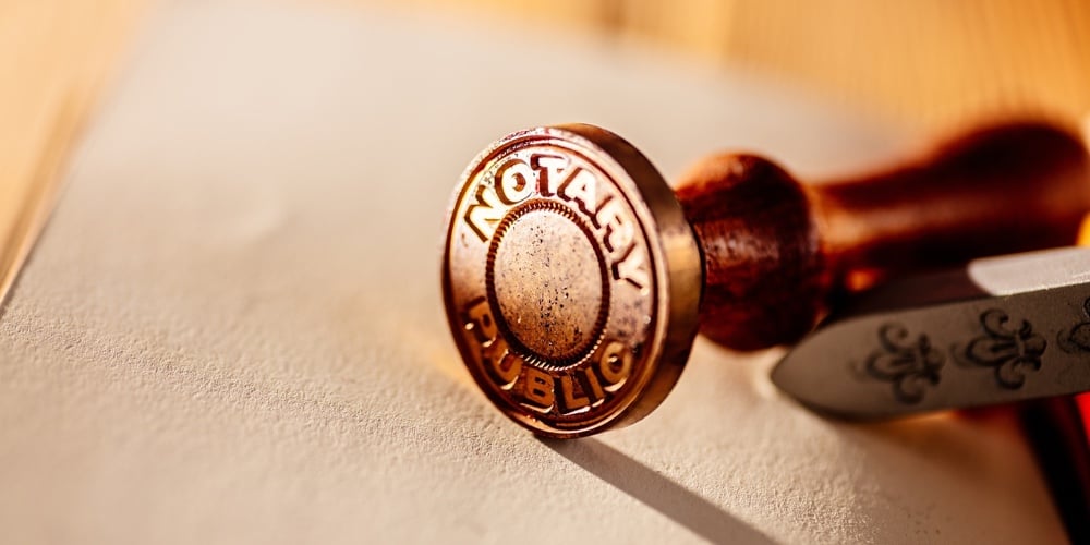 Old Notary Public Metal Stamp On Paper
