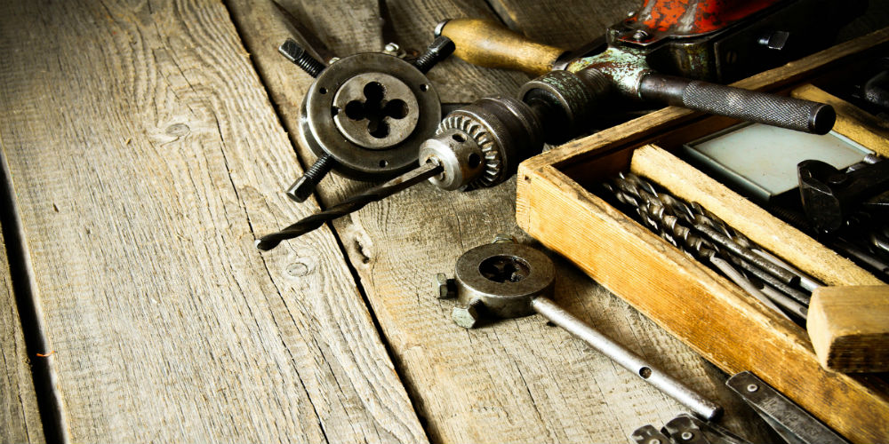 bigstock-Old-drill-a-box-with-drills–85480250