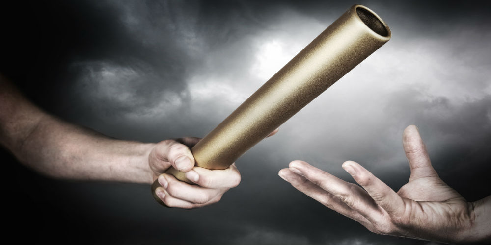 bigstock-Passing-the-baton-62123780