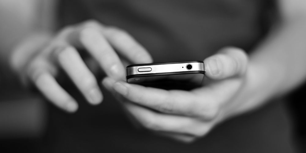 bigstock-Person-holding-smart-phone-in-61830467