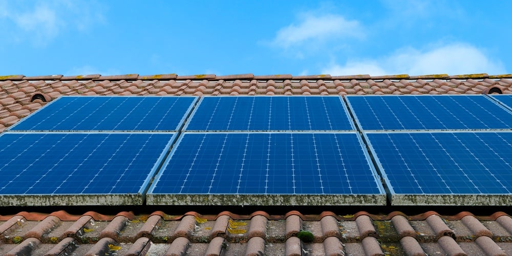 Photovoltaic Panels Installed On The Roof Of A House. Solar Panels On A Rooftop.