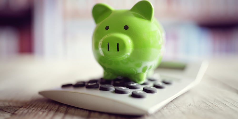 bigstock-Piggy-bank-on-calculator-conce-149892260