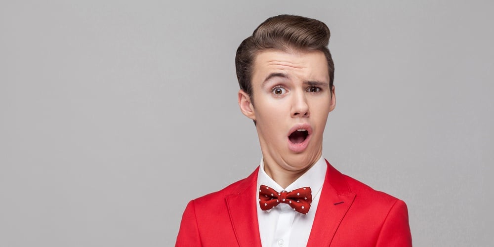 Portrait Of Funny Surprised Man With Stylish Hairdo In Red Tuxedo And Bow Tie Staring In Surprise At|charlesdeluvio-K4mSJ7kc0As-unsplash
