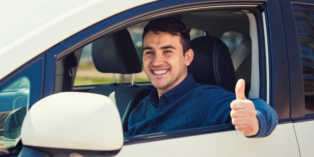 Portrait Of Happy Guy, Uber Driver Showing Thumb Up Positive Gesture, Smiling Gently To Camera. Chee