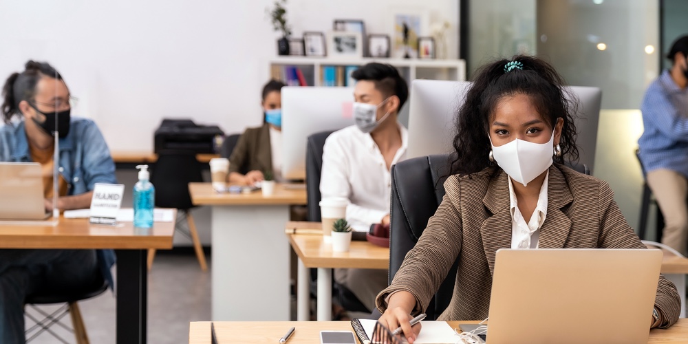 Portrait mixed race of African black and asian office worker wear face mask working in new normal of