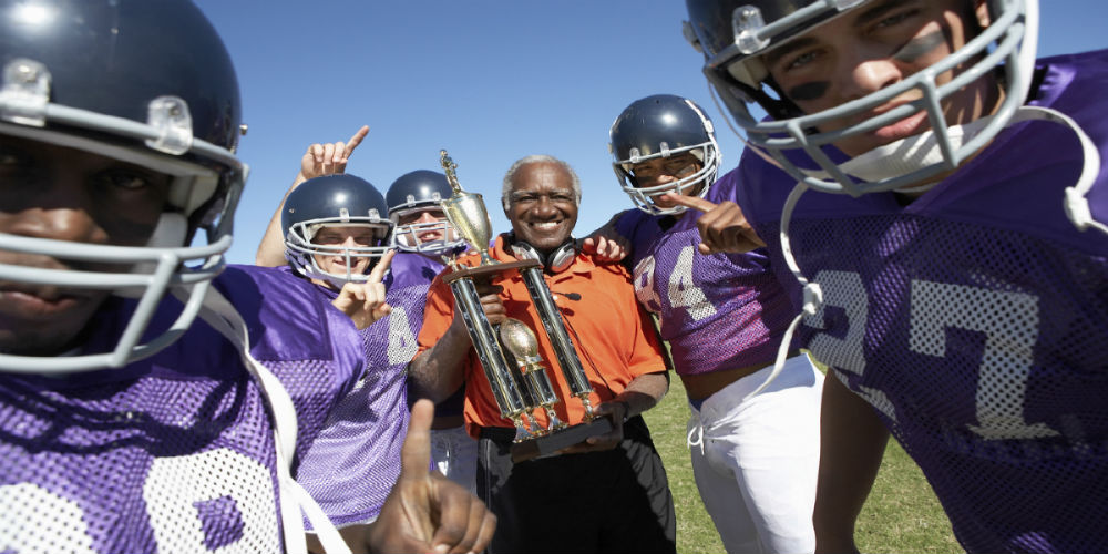 bigstock-Portrait-of-happy-football-tea-49690727